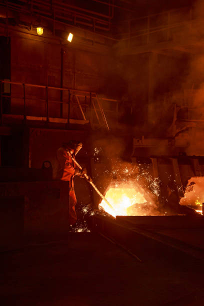 istock Steel foundry worker at blast furnace workshop. 1400313201