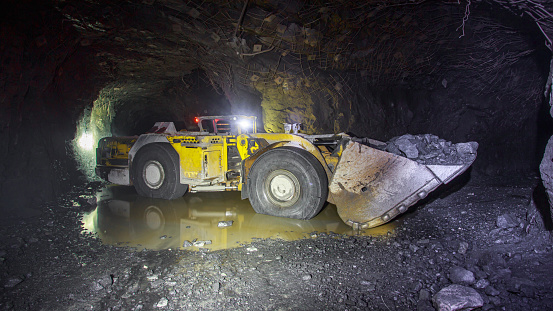 Underground equipment. Special load vehicle for mines and tunnels. Iron ore mine