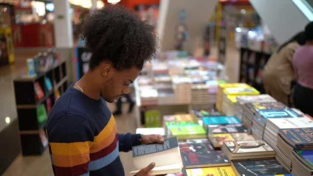 Young man in a bookstore at the mall