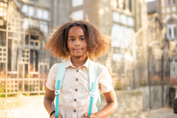 istock Happy school girl with a backpack 1400315639