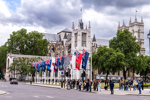 Row of flags seen in front of West Minister Cathedral ready for the Queen`s Platinum Jubilee under an overcast sky in June, taken 20th May 2022.