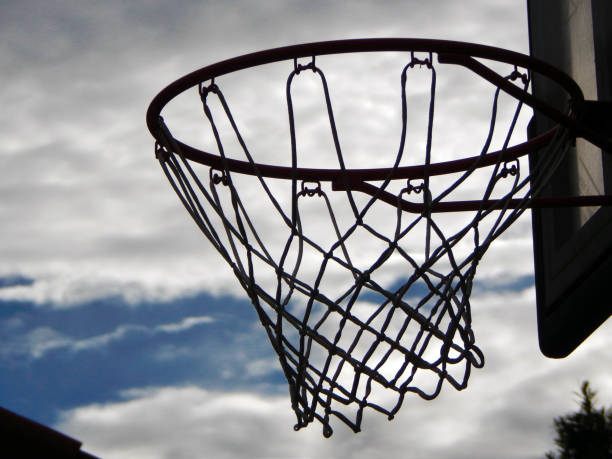 istock Basketball hoop in front of the clouds 1400315889