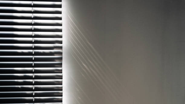 istock Shadows on wall. Abstract light, black shadow overlay from window on white texture wall. Sunlight architecture background. For product presentation, backdrop and mockup, summer seasonal concept. 1400316548