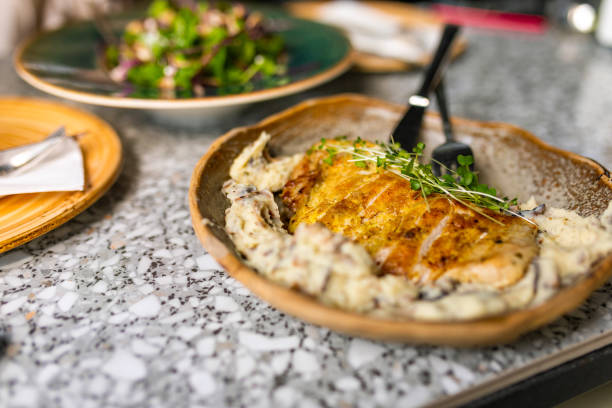 istock Delicious chicken with basil micro plant served on a plate 1400316652