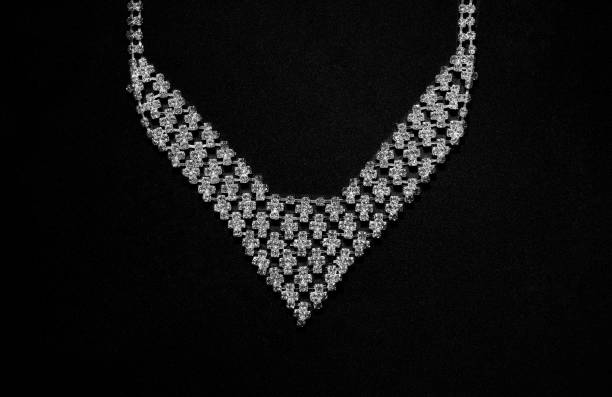 istock Diamond crystal necklace on black background. Black and white 1400316707