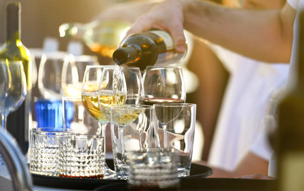istock Bartender pouring white wine into a glass 1400316716