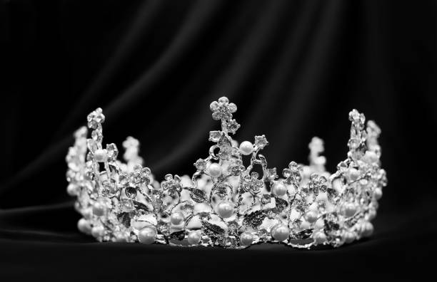 istock Crown with diamonds, crystals and pearl on black luxury background. Black and white 1400316757