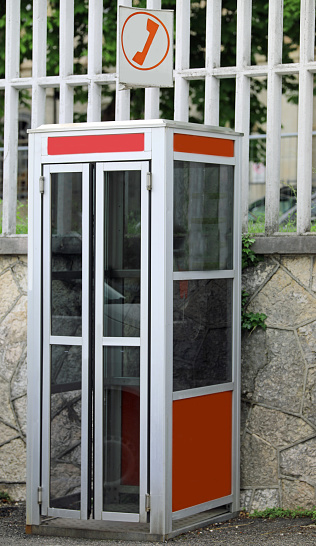 Classic British red colored pay telephone booths  in London, England, UK. Horizontal composition.