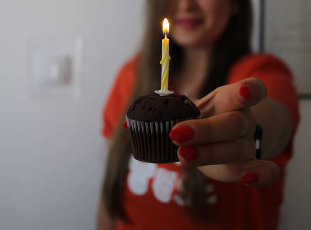 istock A young beautiful woman is celebrating a birthday 1400321386