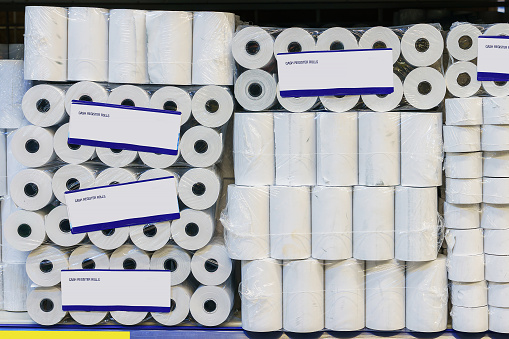 Rolls of tape for cash registers. Background with copy space for text