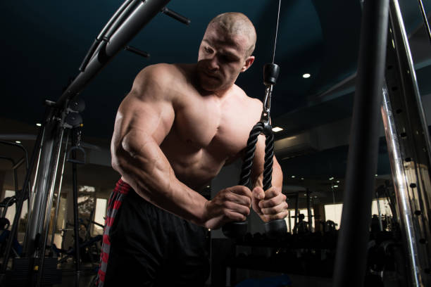 istock Man Exercising Triceps In The Gym 1400329254