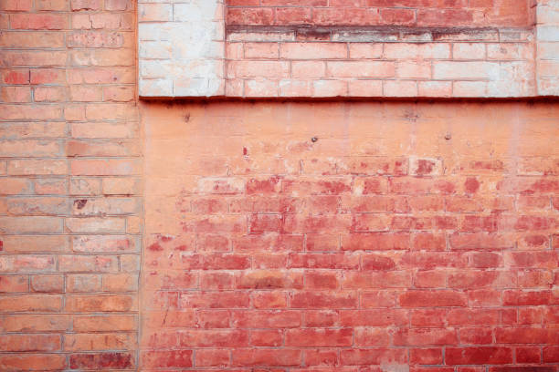 istock Antique red brick wall with age damage. 1400330060