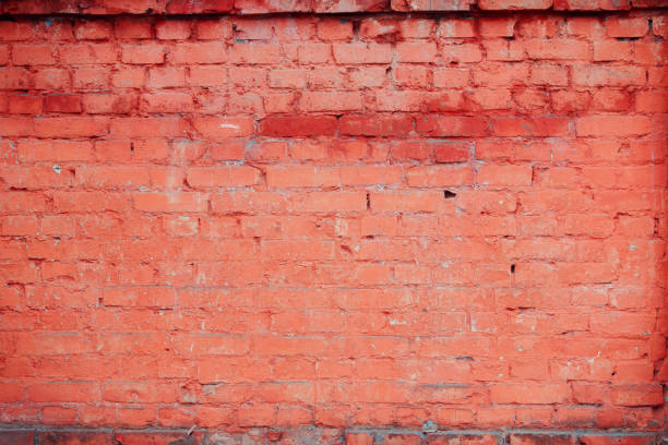 istock Antique red brick wall with age damage. 1400330062