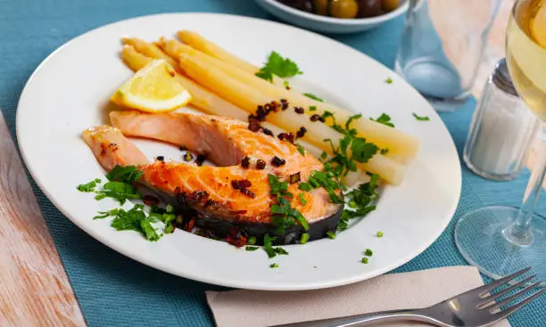 Photo of Grilled salmon steak with asparagus and lemon