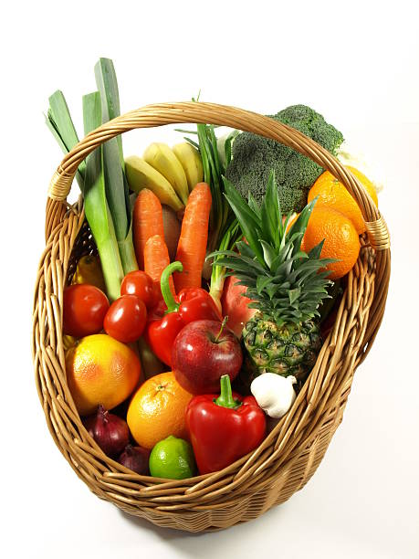 istock Vegetables and fruits in a basket. isolated 140033285
