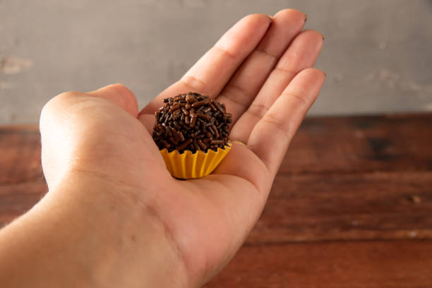 istock Typical Brazilian Brigadiers, hands holding 1400333762