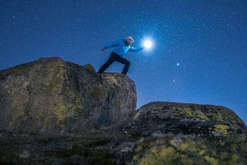 Tourist in nature at night spending time under the millions of stars, away from the city life.