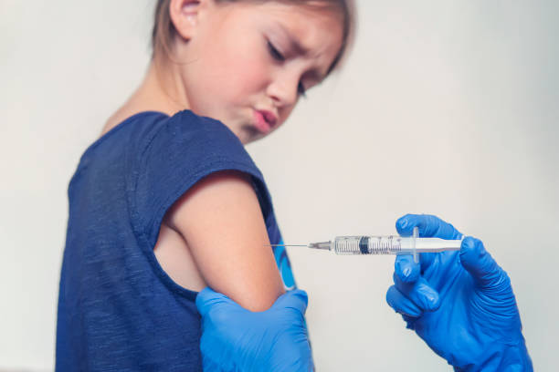 istock Girl having an injection at the doctor's office. 1400340042
