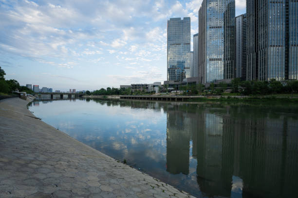 Modern buildings and bridges along the river in sunny days