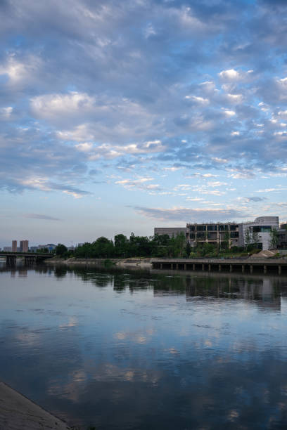 istock Modern buildings and bridges along the river in sunny days 1400343552
