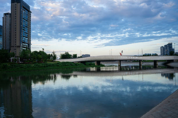 istock Modern buildings and bridges along the river at dusk 1400344125