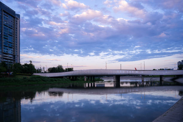 istock Modern buildings and bridges along the river at dusk 1400344128