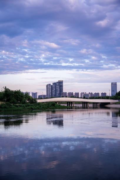 istock Modern buildings and bridges along the river at dusk 1400344357