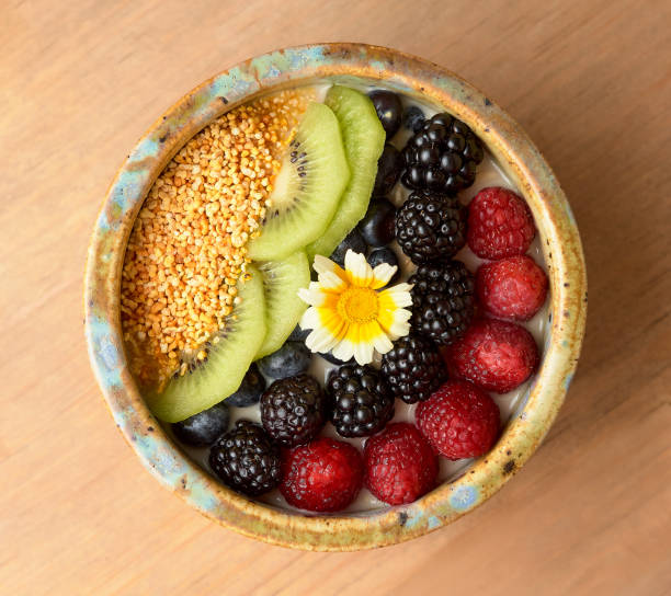 istock Fruit bowl with raspberries, blackberries, kiwi, amaranth, and yogurt. 1400348189