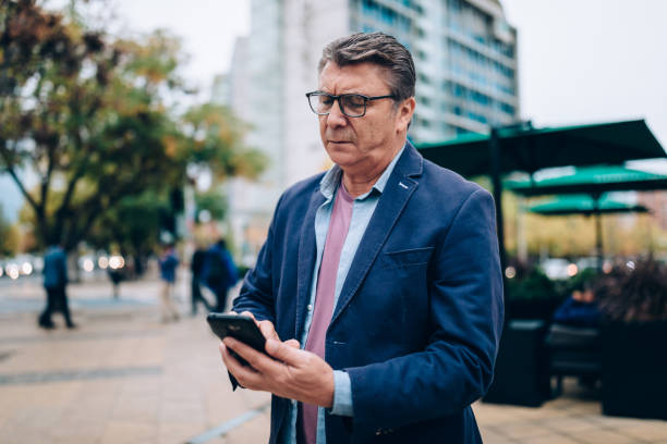istock Businessman using cell phone at downtown Santiago 1400349201