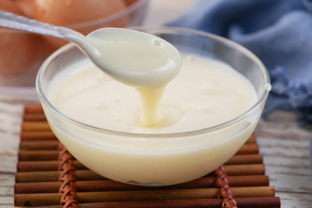 istock condensed milk in a bowl close up, 1400349796