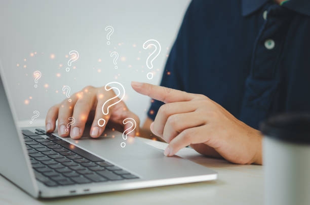 istock businessman pointing a question mark. Business computer technology concept. 1400351517
