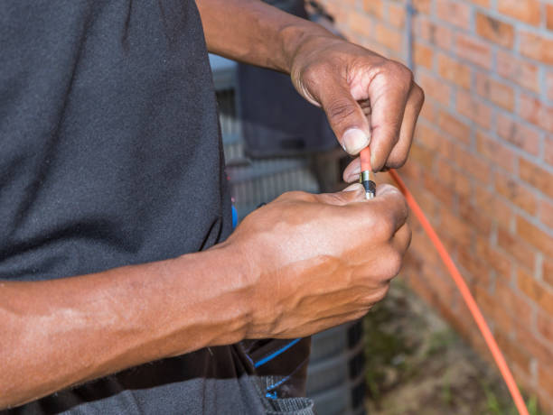 Cable Repairman Servicing Residential Patron stock photo