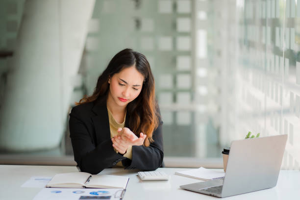 istock An accountant woman has wrist pain after using a computer for a long time. pain while using laptop at desk 1400354530