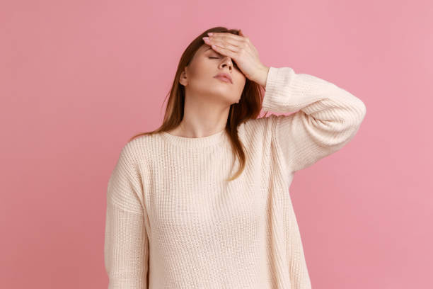 istock Frustrated blond woman making facepalm gesture, shocked, ashamed with lose, failure. 1400355529