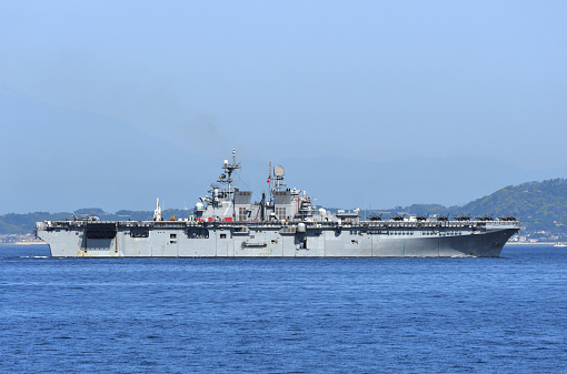 Kanagawa, Japan - May 29, 2022: United States Navy USS Tripoli (LHA-7), America-class amphibious assault ship sailing in Tokyo bay.