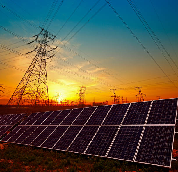 istock Solar panels and electric tower, green energy 1400357300