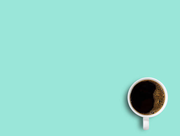istock Cup of coffee on green table background. 1400363061