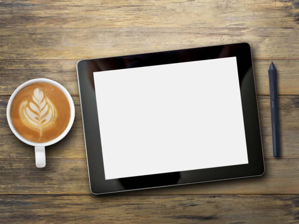 istock Office desk with tablet,notebook,pen mouse and coffee on wood table background 1400363165