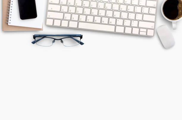 istock Top view Minmal workspace with keyboard, smartphone and coffee cup copy space on white background. 1400363236