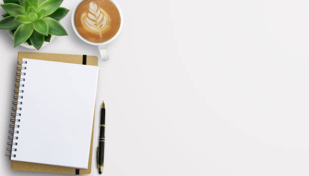 istock Office desk with stationary on white table background. 1400363333