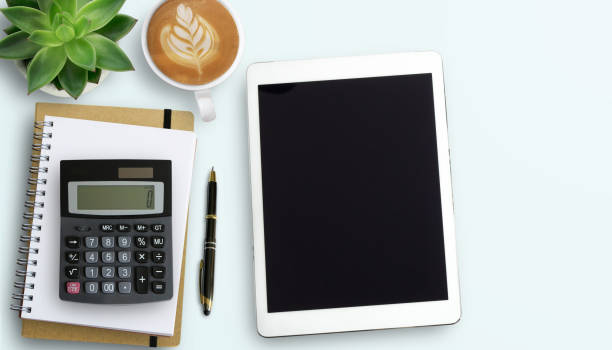 istock Office desk with stationary on white table background. 1400363334