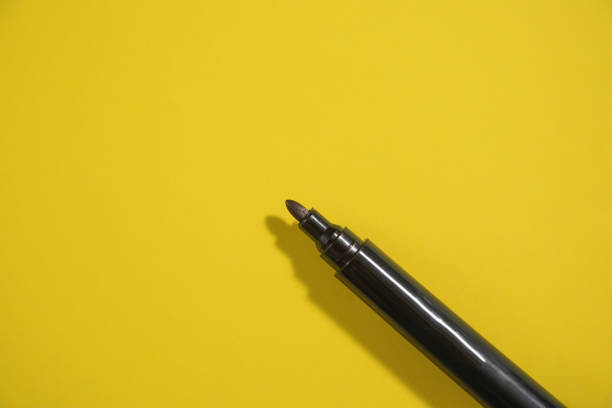 istock Marker on the yellow background. 1400370214