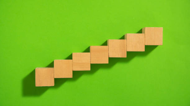 istock Empty wooden cubes on the green background. 1400370234