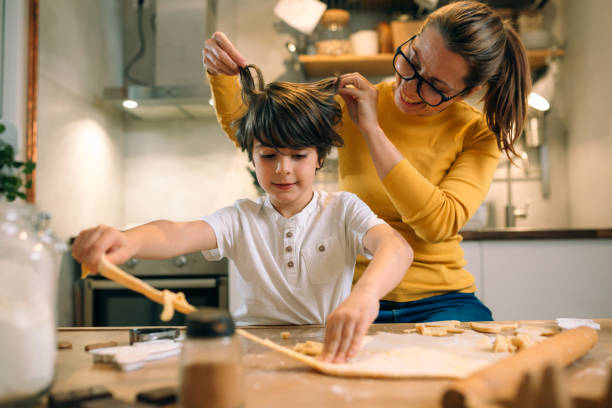 istock mother and her son prepares cookies in home kitchen 1400371273