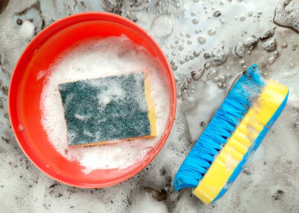 istock Cleaning Brush - dirty and dusty detergent foam background. 1400372337