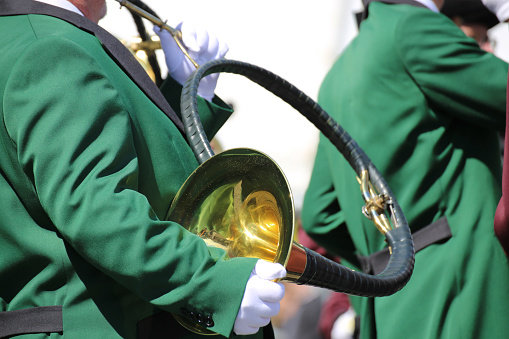 Close up of musicians playing the hunting horn