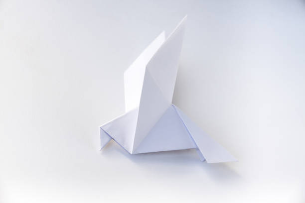 istock Paper dove origami isolated on a white background 1400374401
