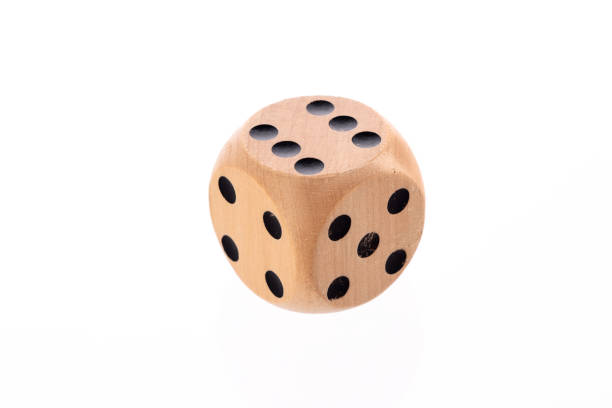 Closeup of stacks of multi-coloured dice on a white background;