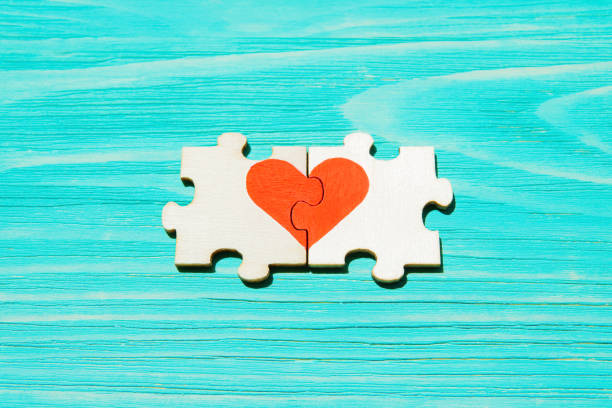 istock Heart made from jigsaw puzzle pieces on blue 1400378101