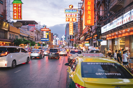 Bangkok, Thailand - May 10 2022: A busy street scene at Chinatown, pedestrians around China town Traffic jam in Yaowarat Street in Bangkok Thailand